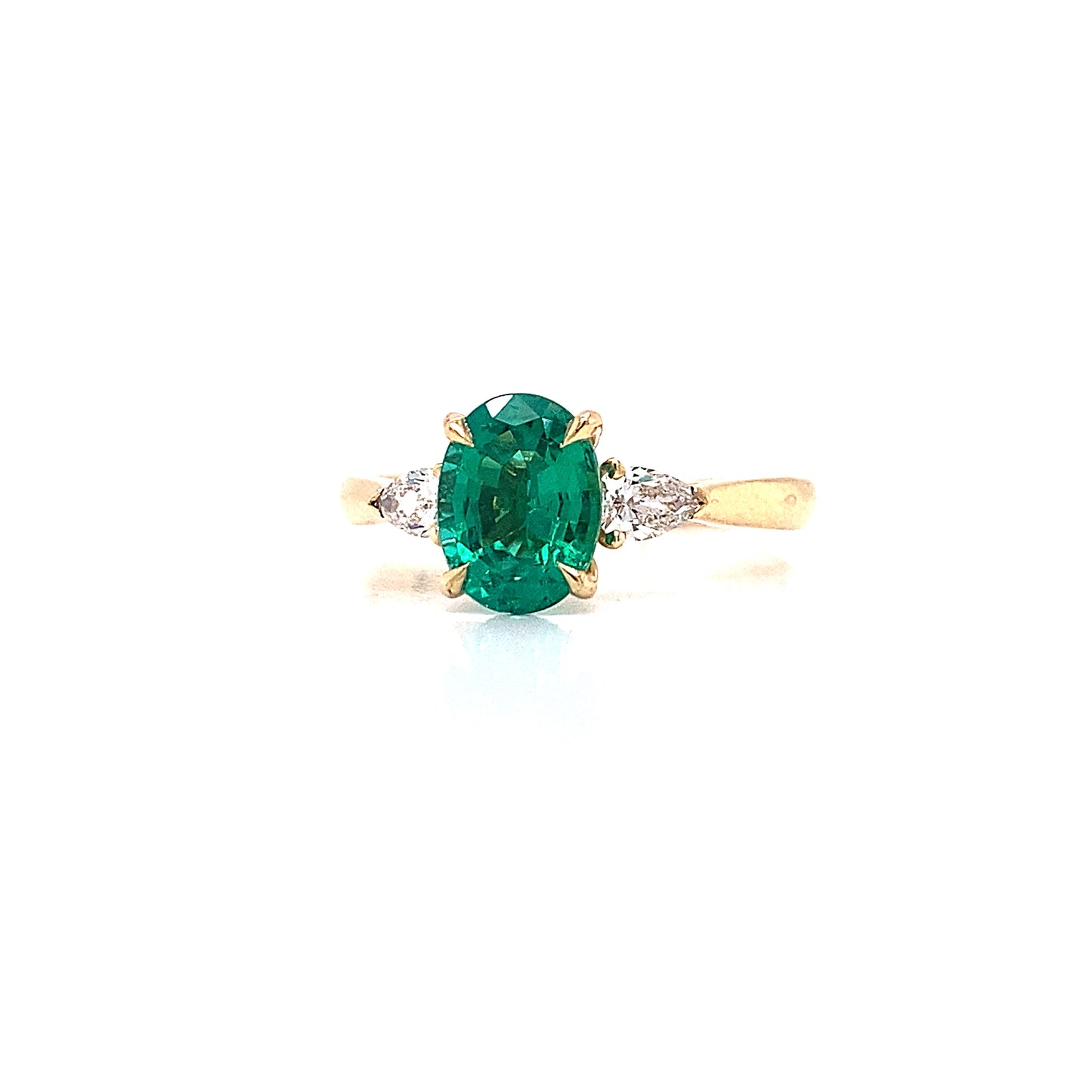 Oval emerald & pear shaped diamond engagement ring