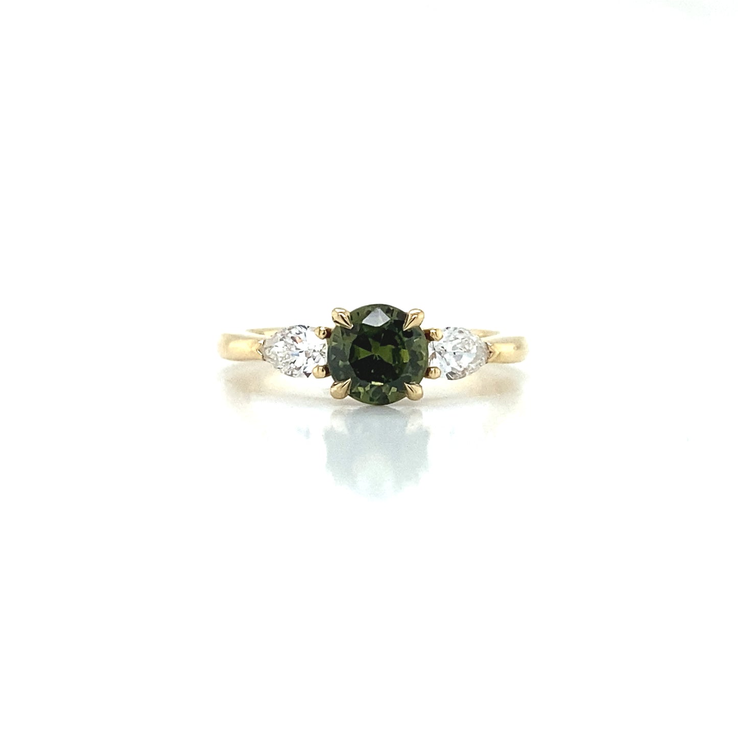 Round cut green sapphire & pear shape diamond trilogy engagement ring