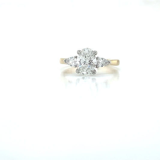 18ct yellow gold & platinum oval cut and pear shaped diamond trilogy engagement ring