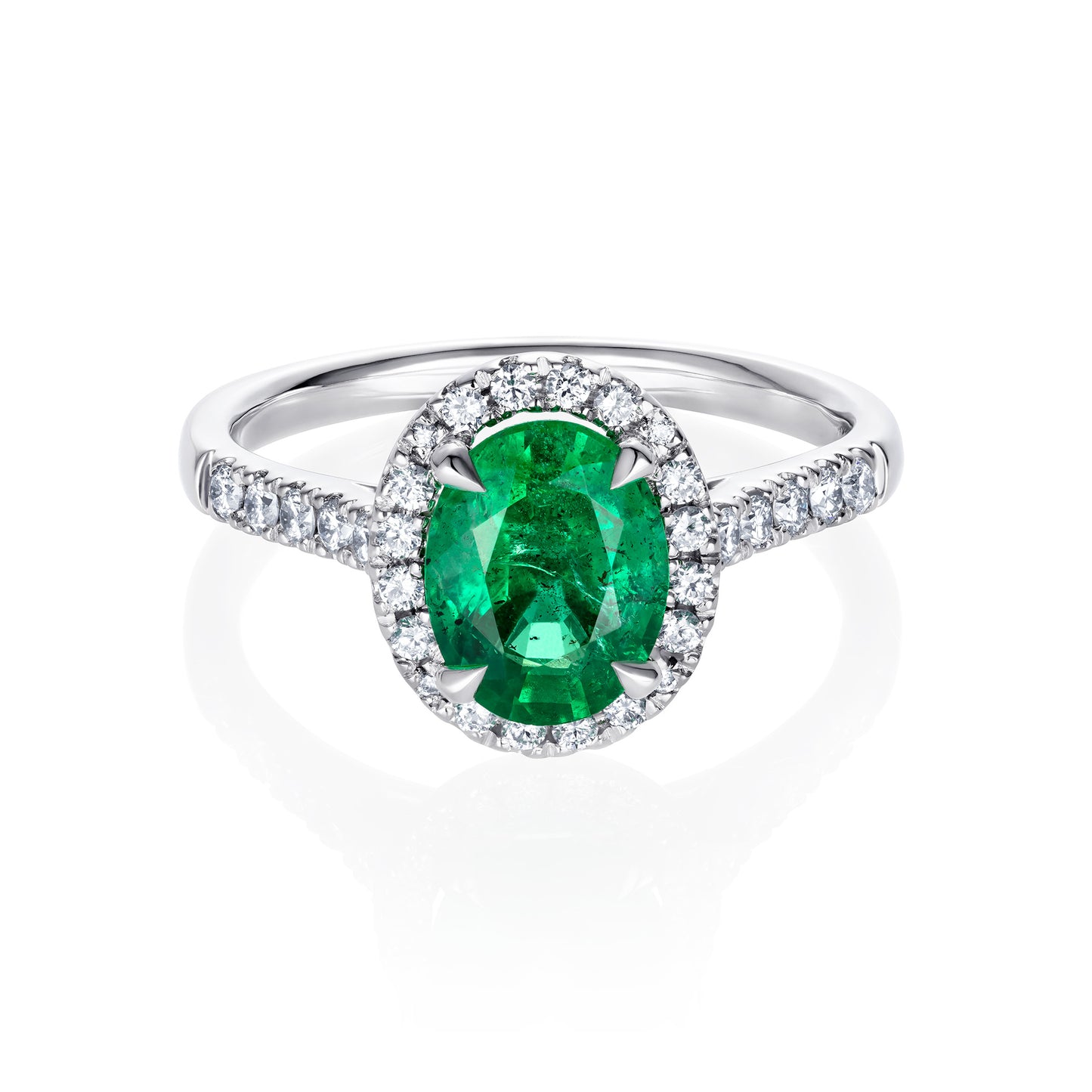 Oval emerald & diamond set halo engagement ring in platinum
